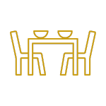 Icon of a dining area with table and chairs, available in Galápagos Nomad apartments.