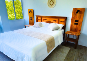 Comfortable bedroom in Seashell Suite with a cozy bed.