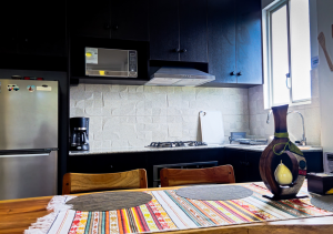 Elegant dining area with a modern table and comfortable chairs, designed for shared meals in a cozy atmosphere.