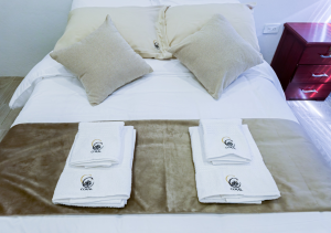 Cozy second bedroom with a comfortable bed, modern furnishings, and a tranquil atmosphere.