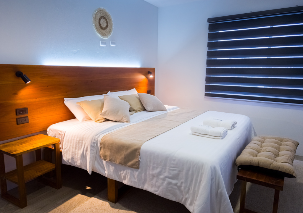 Cozy and stylish bedroom with a comfortable bed, soft lighting, and a relaxing ambiance.