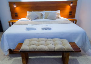 Cozy and stylish bedroom with a comfortable bed, soft lighting, and a relaxing ambiance.