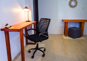 Dedicated workspace in Seashell Suite with a desk and chair.